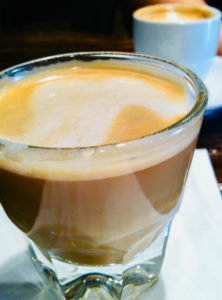 Drink coffee at an independent shop