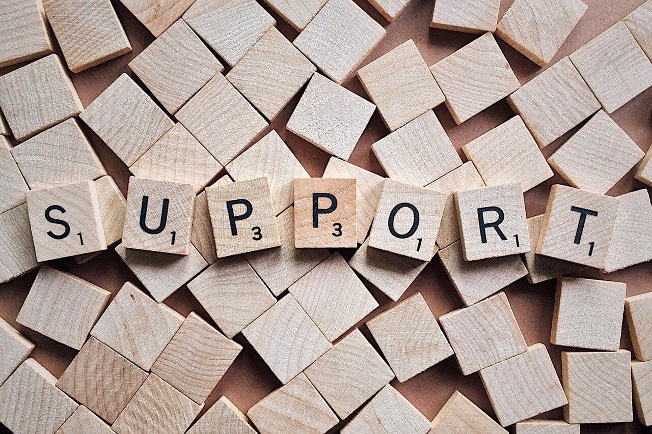 Scrable tiles spell Support